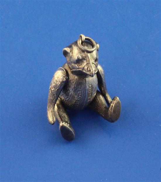 An Edwardian novelty silver pin cushion modelled as a bear with articulated limbs approx. 2in.